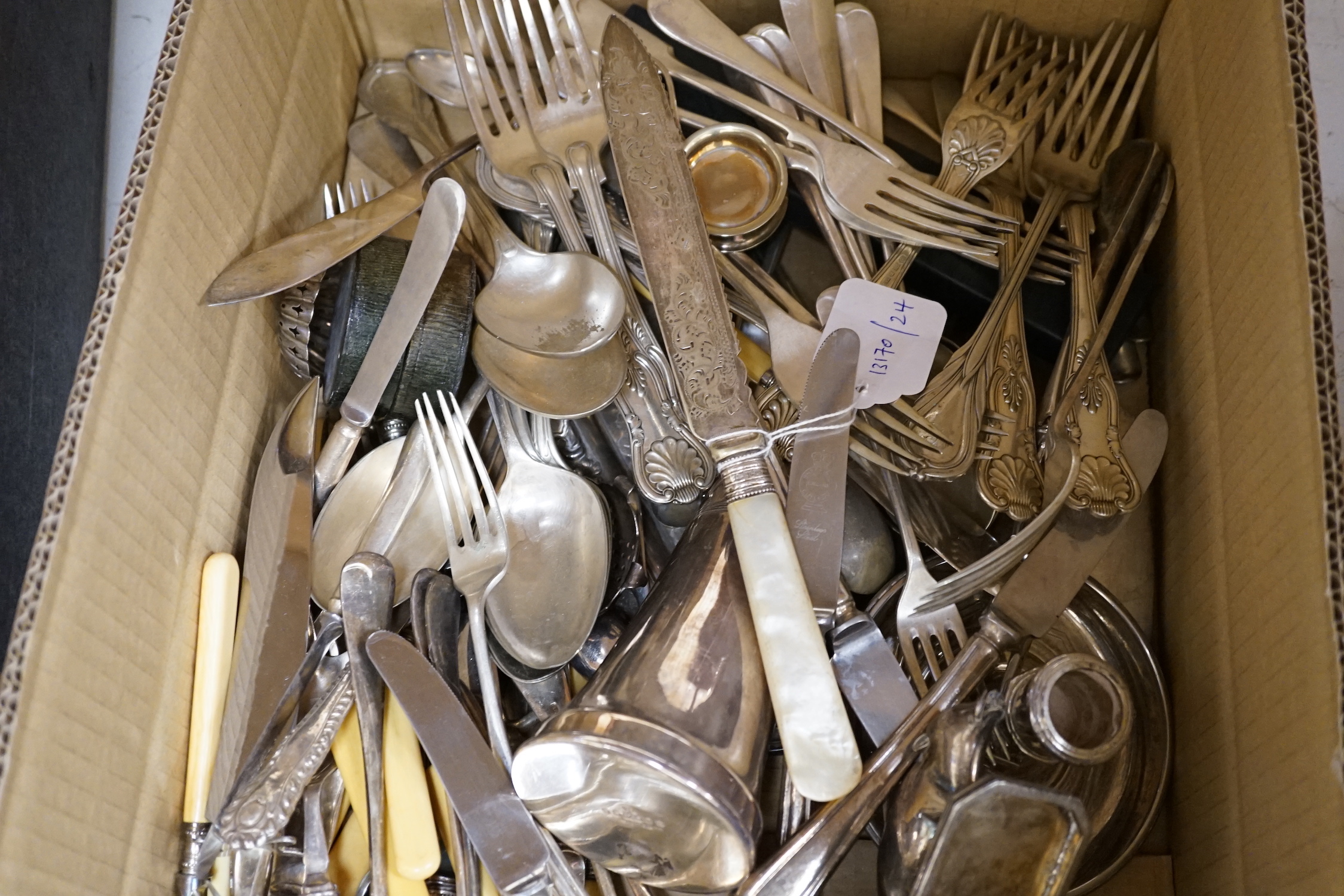 A group of assorted plated flatware
